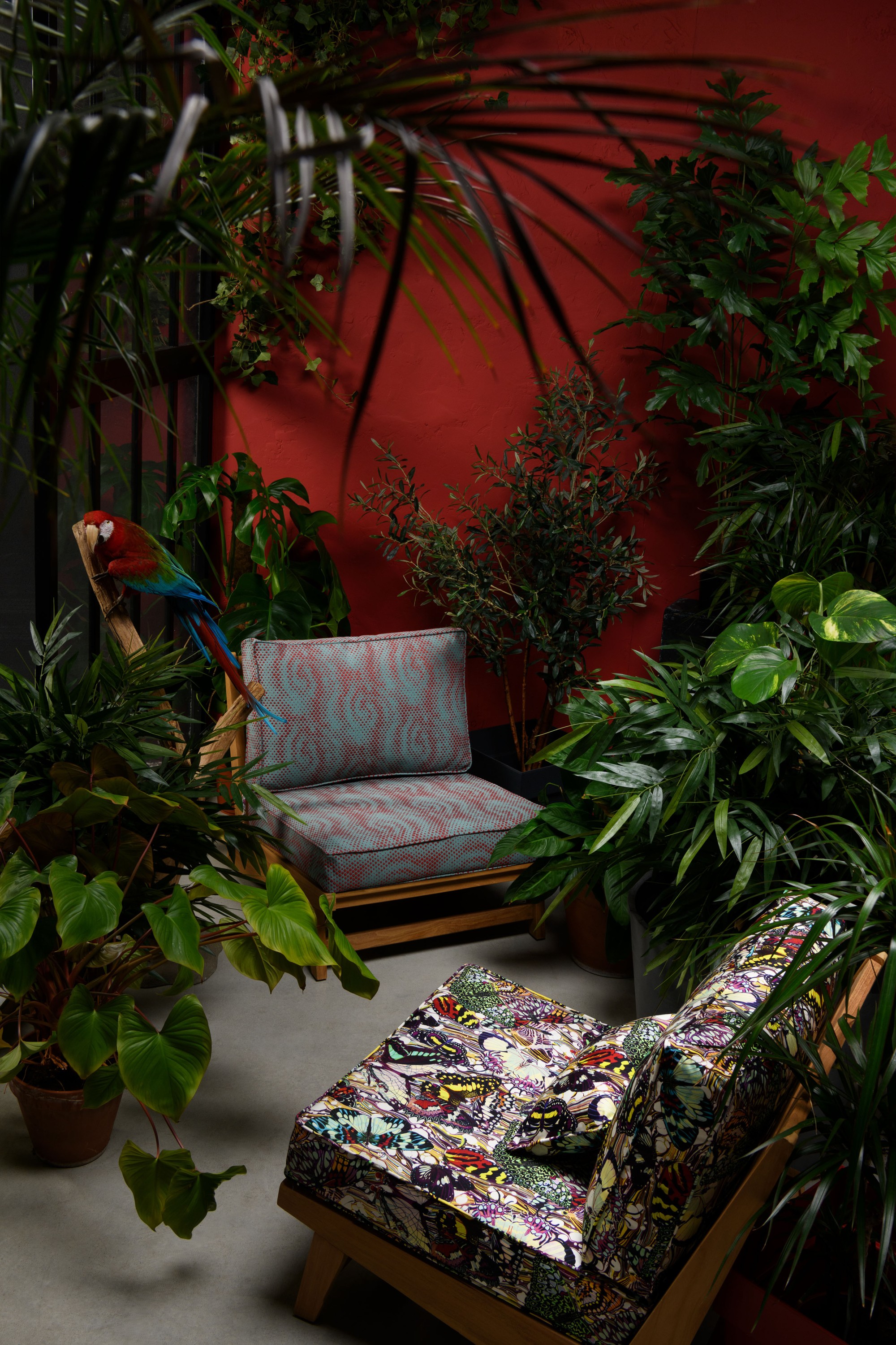 "Olia" armchair – Tikamoon, PAPILLONS 3613 fabric, color Multicolor. TROIS D 3619 fabric, color Aqua rouge. Cushion, TROIS D 3619 fabric, color Acqua prune.