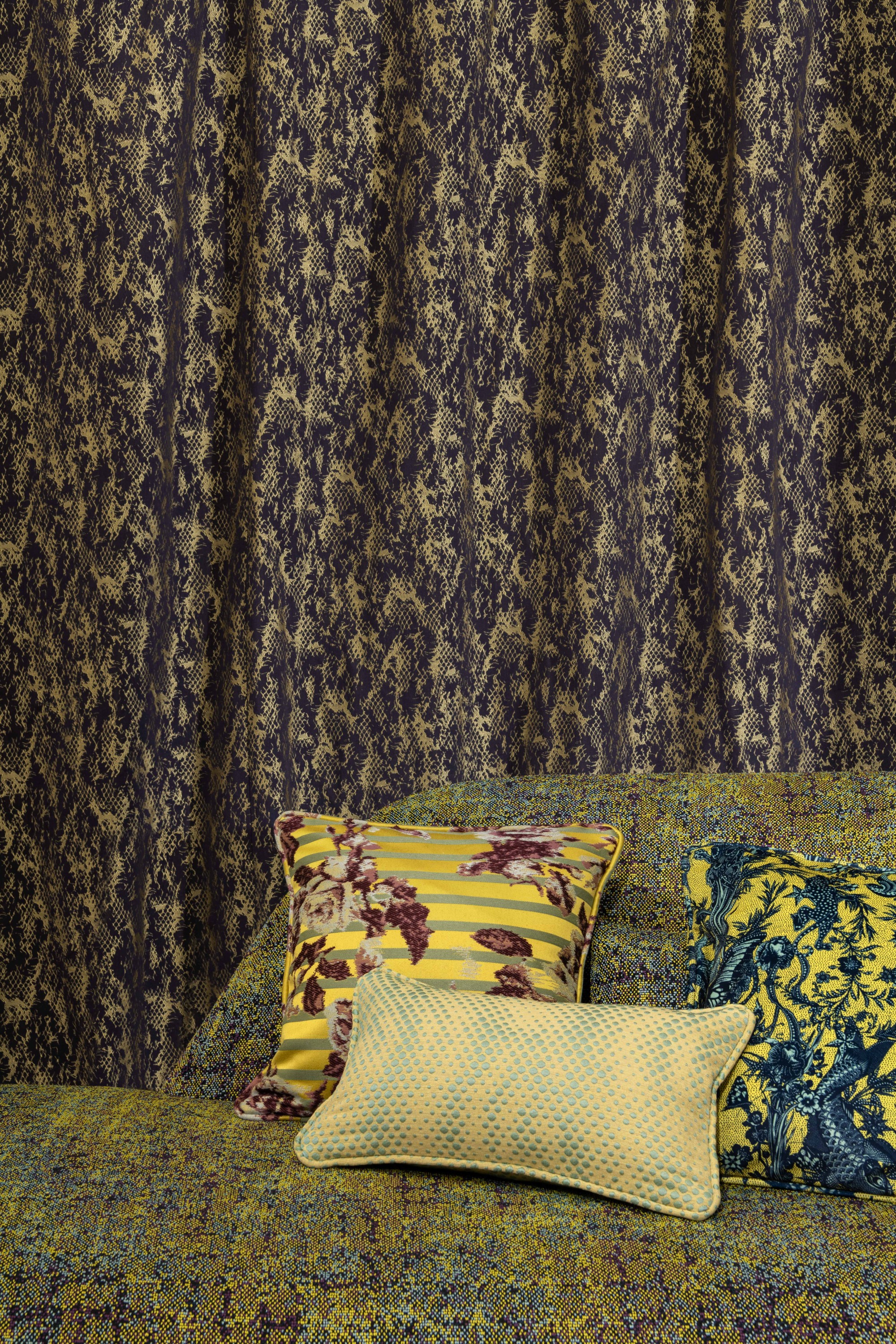 Santorin 3617 fabric curtains, color Raisin. Perle daybed  Roche Bobois, Punti 3616 fabric, color Mimosa. Cushions in Croisière 3615 fabric, color Bergamotte. Javanaise 3618 fabric, color Limoncello. Trois D 3619 fabric, color Bergamotte. Patchwork 3614 f